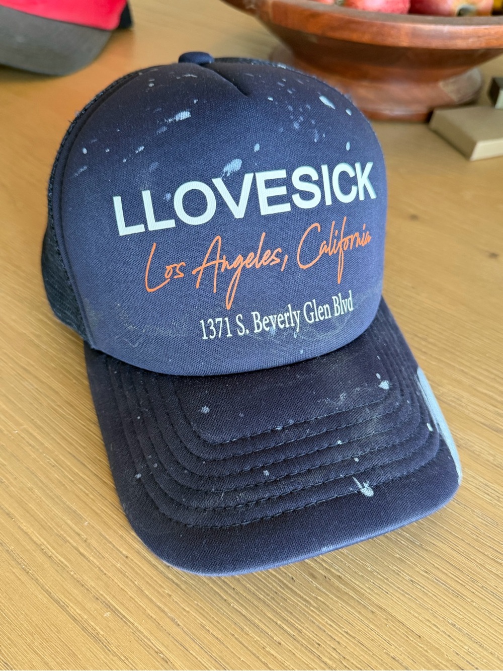 Lovesick Navy Trucker Hat with White and Orange Logo